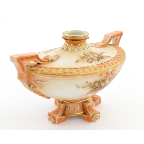 114 - A Hadley's Worcester twin handled squat vase of boat form with floral and foliate decoration. Marked... 