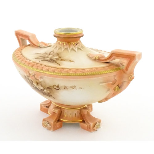 114 - A Hadley's Worcester twin handled squat vase of boat form with floral and foliate decoration. Marked... 