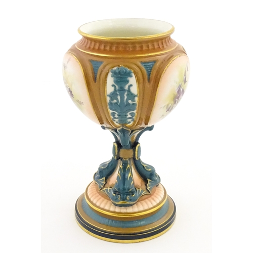 115 - A Hadley's Worcester pedestal vase of goblet form decorated with wild flowers. Marked under and numb... 