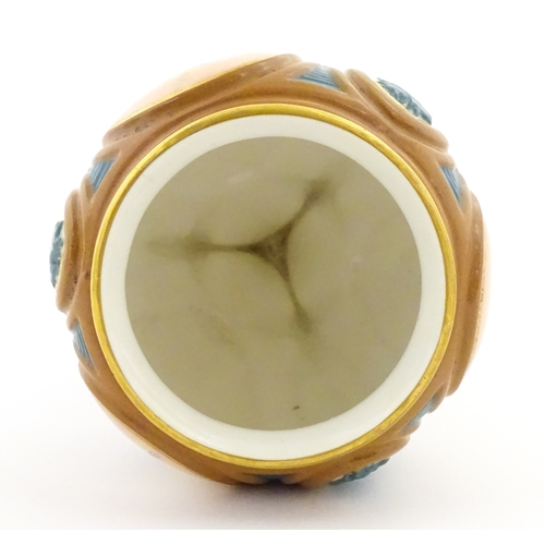 115 - A Hadley's Worcester pedestal vase of goblet form decorated with wild flowers. Marked under and numb... 