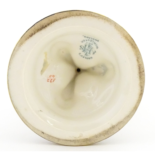 115 - A Hadley's Worcester pedestal vase of goblet form decorated with wild flowers. Marked under and numb... 