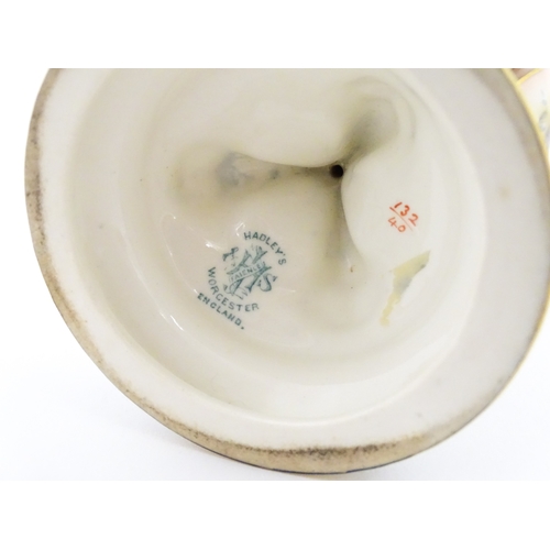 115 - A Hadley's Worcester pedestal vase of goblet form decorated with wild flowers. Marked under and numb... 