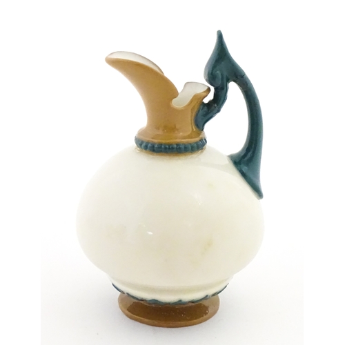 116 - A small Hadley's Worcester jug with shaped handle. Marked under. Approx. 3 1/2