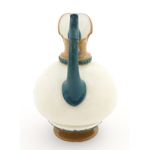 116 - A small Hadley's Worcester jug with shaped handle. Marked under. Approx. 3 1/2