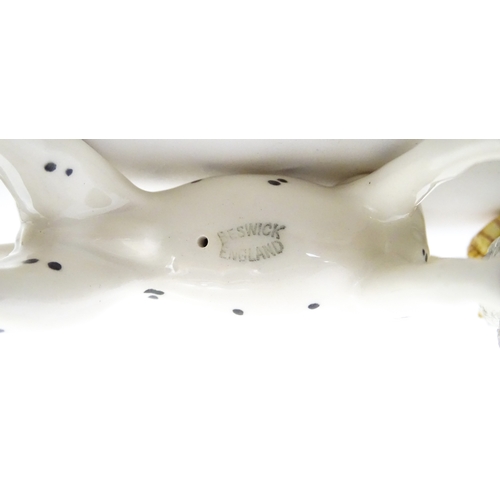 182 - Four assorted ceramic models to include a Beswick Dalmatian dog, a Royal Copenhagen Girl with Geese ... 