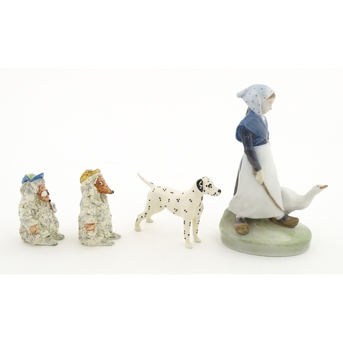 182 - Four assorted ceramic models to include a Beswick Dalmatian dog, a Royal Copenhagen Girl with Geese ... 
