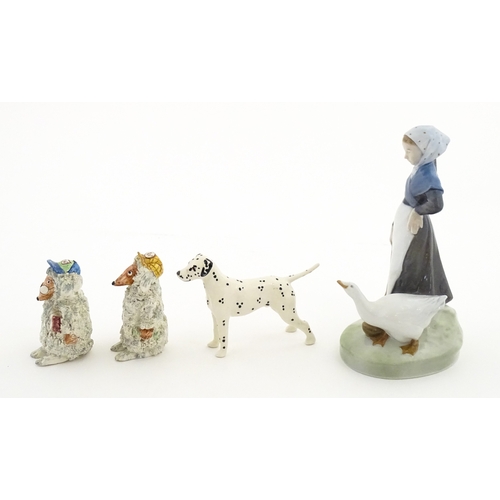 182 - Four assorted ceramic models to include a Beswick Dalmatian dog, a Royal Copenhagen Girl with Geese ... 