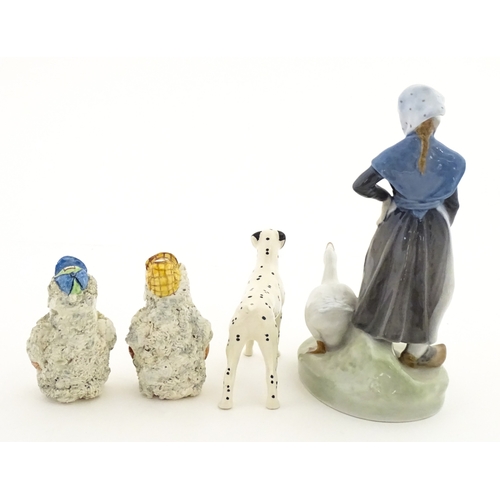 182 - Four assorted ceramic models to include a Beswick Dalmatian dog, a Royal Copenhagen Girl with Geese ... 