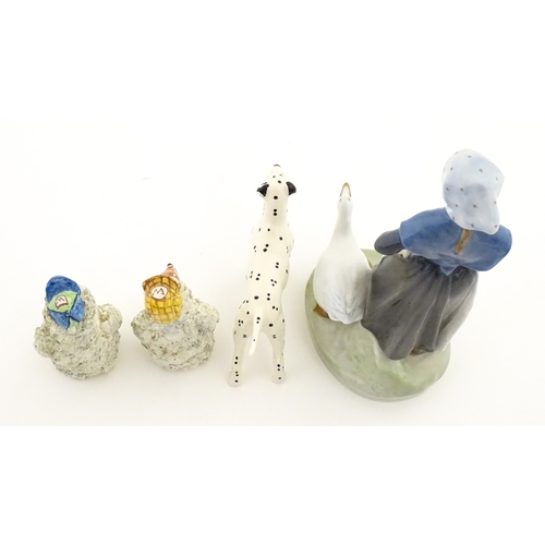182 - Four assorted ceramic models to include a Beswick Dalmatian dog, a Royal Copenhagen Girl with Geese ... 