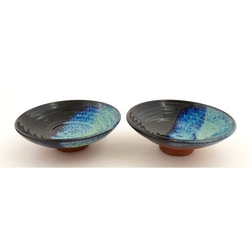 187 - Two Rupert Blamire studio pottery footed dishes. Marked under with maker's marks. Approx. 6