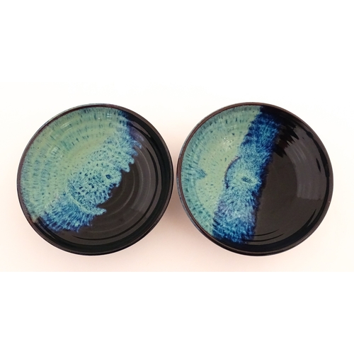 187 - Two Rupert Blamire studio pottery footed dishes. Marked under with maker's marks. Approx. 6