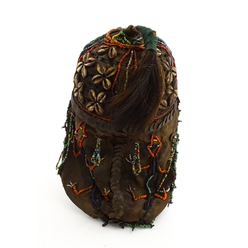 1169 - Ethnographic / Native / Tribal : A tribal headdress / hat with beadwork and cowrie shell decoration ... 