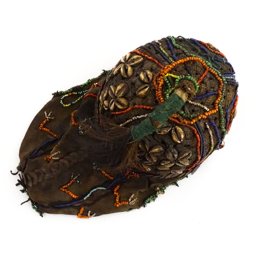 1169 - Ethnographic / Native / Tribal : A tribal headdress / hat with beadwork and cowrie shell decoration ... 