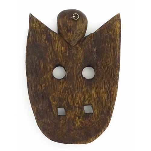 1170 - Ethnographic / Native / Tribal : Two African carved wooden masks, both with teeth bared and tongue o... 