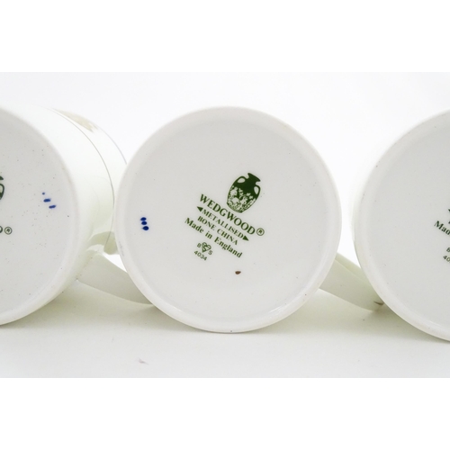 194 - A set of six Wedgwood coffee cups and saucers with gilt Harrow School crest detail. Box approx. 12 3... 