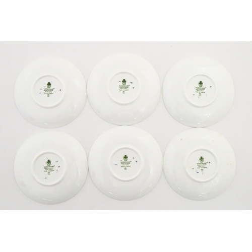 194 - A set of six Wedgwood coffee cups and saucers with gilt Harrow School crest detail. Box approx. 12 3... 