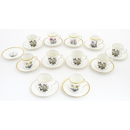 195 - Twelve Royal Worcester coffee cups and saucers decorated in the British Wildflower pattern. Cups app... 