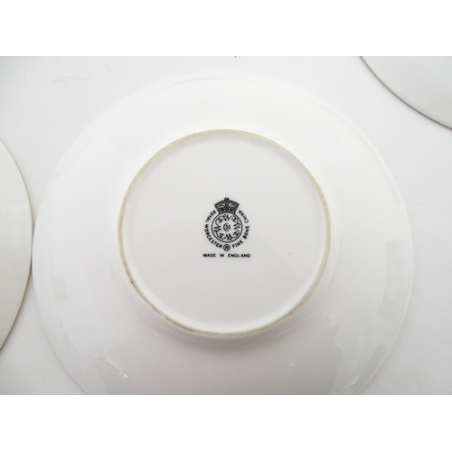 195 - Twelve Royal Worcester coffee cups and saucers decorated in the British Wildflower pattern. Cups app... 