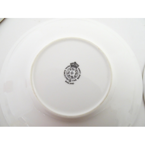 195 - Twelve Royal Worcester coffee cups and saucers decorated in the British Wildflower pattern. Cups app... 