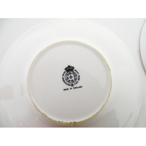 195 - Twelve Royal Worcester coffee cups and saucers decorated in the British Wildflower pattern. Cups app... 