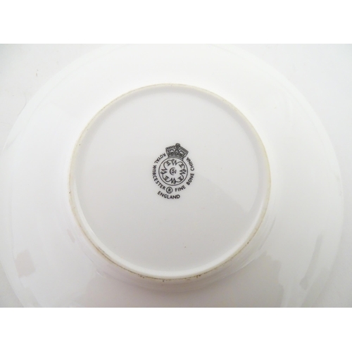 195 - Twelve Royal Worcester coffee cups and saucers decorated in the British Wildflower pattern. Cups app... 