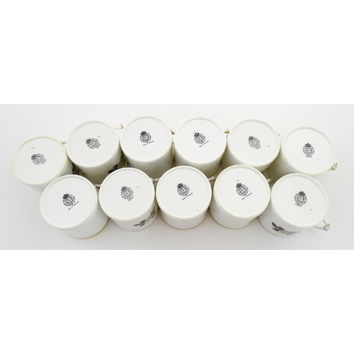 195 - Twelve Royal Worcester coffee cups and saucers decorated in the British Wildflower pattern. Cups app... 