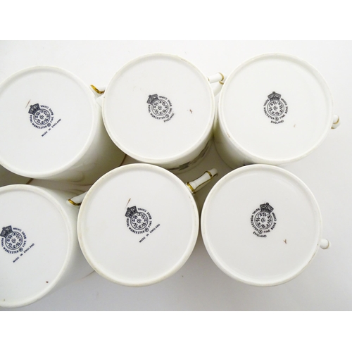 195 - Twelve Royal Worcester coffee cups and saucers decorated in the British Wildflower pattern. Cups app... 