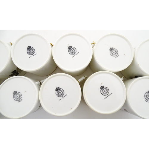 195 - Twelve Royal Worcester coffee cups and saucers decorated in the British Wildflower pattern. Cups app... 