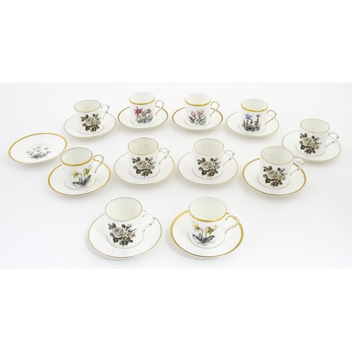 195 - Twelve Royal Worcester coffee cups and saucers decorated in the British Wildflower pattern. Cups app... 
