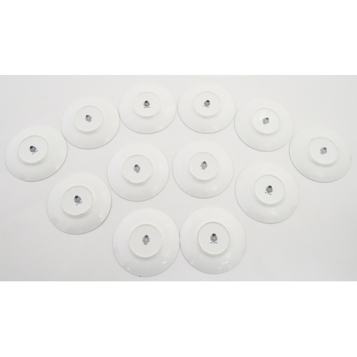 195 - Twelve Royal Worcester coffee cups and saucers decorated in the British Wildflower pattern. Cups app... 
