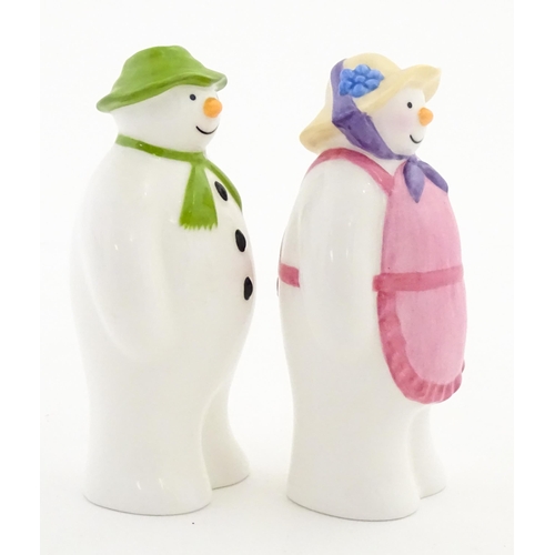 196 - A boxed Coalport limited edition The Snowman cruet comprising Snowman and Lady Snowman salt and pepp... 