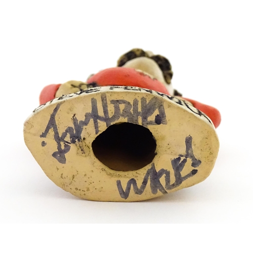 197 - A John Hughes pottery Grogg of Steve Fenwick in a Welsh red rugby jersey. Signed under. Approx. 6