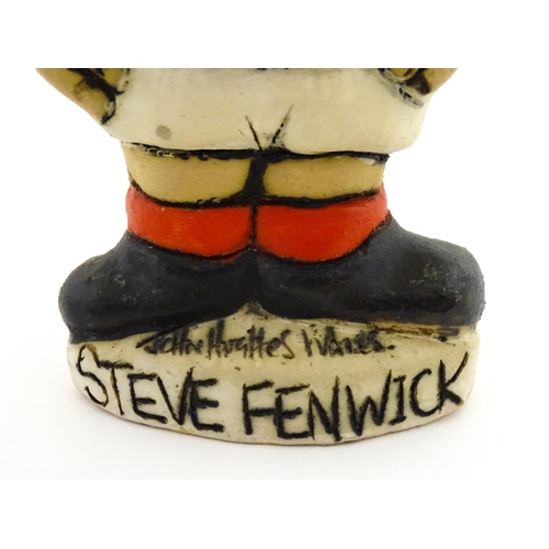 197 - A John Hughes pottery Grogg of Steve Fenwick in a Welsh red rugby jersey. Signed under. Approx. 6