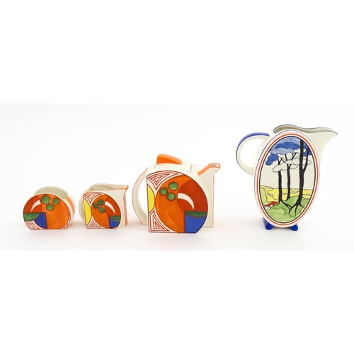 203 - A Wedgwood Clarice Cliff Centenary Stamford teapot, sugar bowl and cream jug in the Melon pattern, a... 