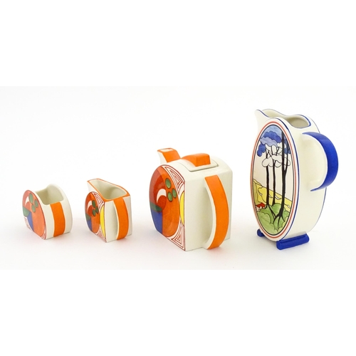 203 - A Wedgwood Clarice Cliff Centenary Stamford teapot, sugar bowl and cream jug in the Melon pattern, a... 