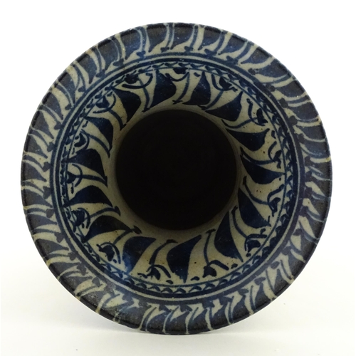 208 - A Continental blue and  white vase with flared rim having banded foliate decoration. Approx. 12