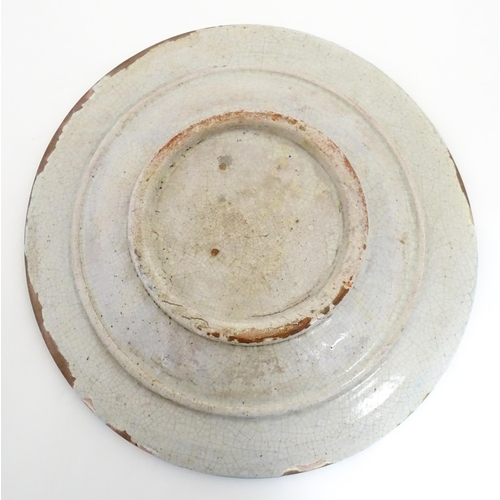 209 - Two Iznik pottery chargers decorated with blue and turquoise flowers and foliage. Largest approx. 15... 