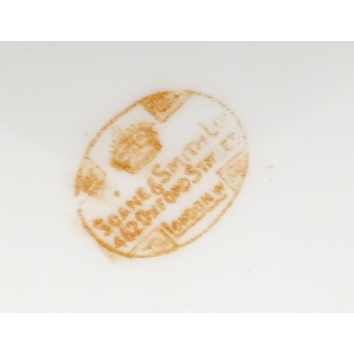 213 - A quantity of Soane & Smith Ltd. dessert wares with flower and garland detail, to include plates and... 