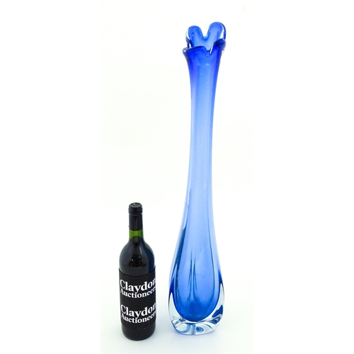 232 - A large blue glass vase of elongated swung form with flared rim. Possibly Murano. Approx. 26