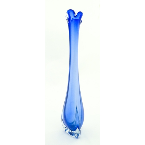 232 - A large blue glass vase of elongated swung form with flared rim. Possibly Murano. Approx. 26