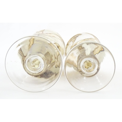 298 - Two Mdina glass earthtones drinking glasses of goblet form. One bearing Mdina label. Largest approx.... 