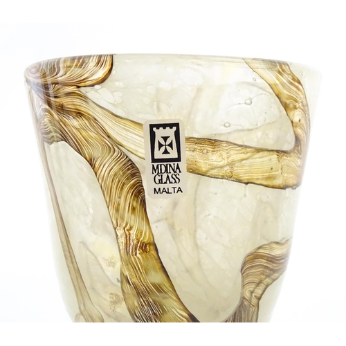 298 - Two Mdina glass earthtones drinking glasses of goblet form. One bearing Mdina label. Largest approx.... 