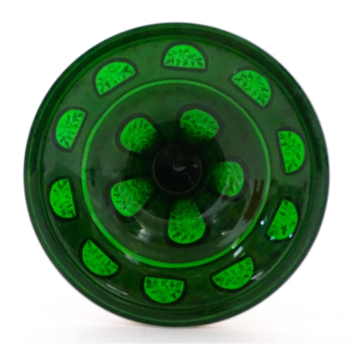 304 - A Bohemian green glass vase of flared form with white overlay and gilt detail. Approx. 12 1/4