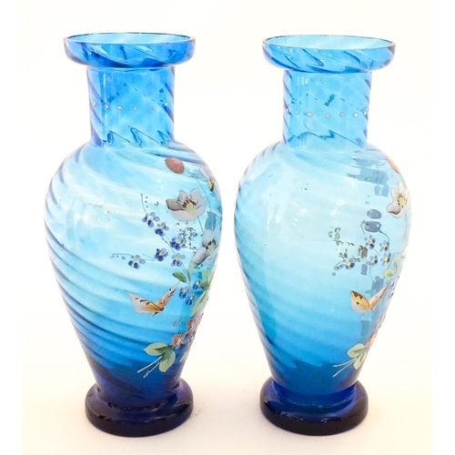 305 - A pair of Victorian blue glass vases with hand painted floral decoration. Approx. 10
