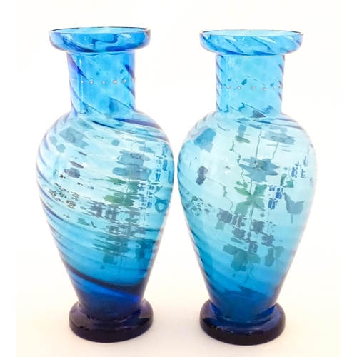 305 - A pair of Victorian blue glass vases with hand painted floral decoration. Approx. 10