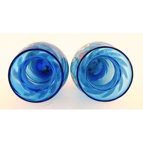 305 - A pair of Victorian blue glass vases with hand painted floral decoration. Approx. 10
