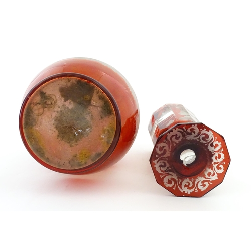 306 - A Bohemian red glass carafe / vase with etched stag decoration. Together with a French ruby glass go... 