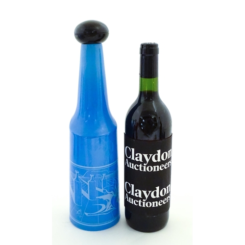 307 - A 1970s Rosso Antico glass bottle designed by Salvador Dali. Approx. 13 1/42 high