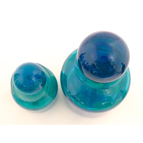 309 - A large Mdina blue glass decanter. Together with a smaller example. Both signed Mdina under. Largest... 