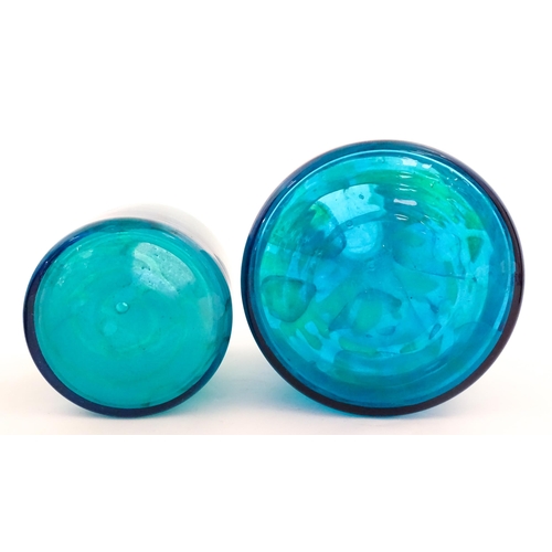 309 - A large Mdina blue glass decanter. Together with a smaller example. Both signed Mdina under. Largest... 